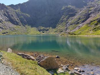 lake from shore, with mountain behind